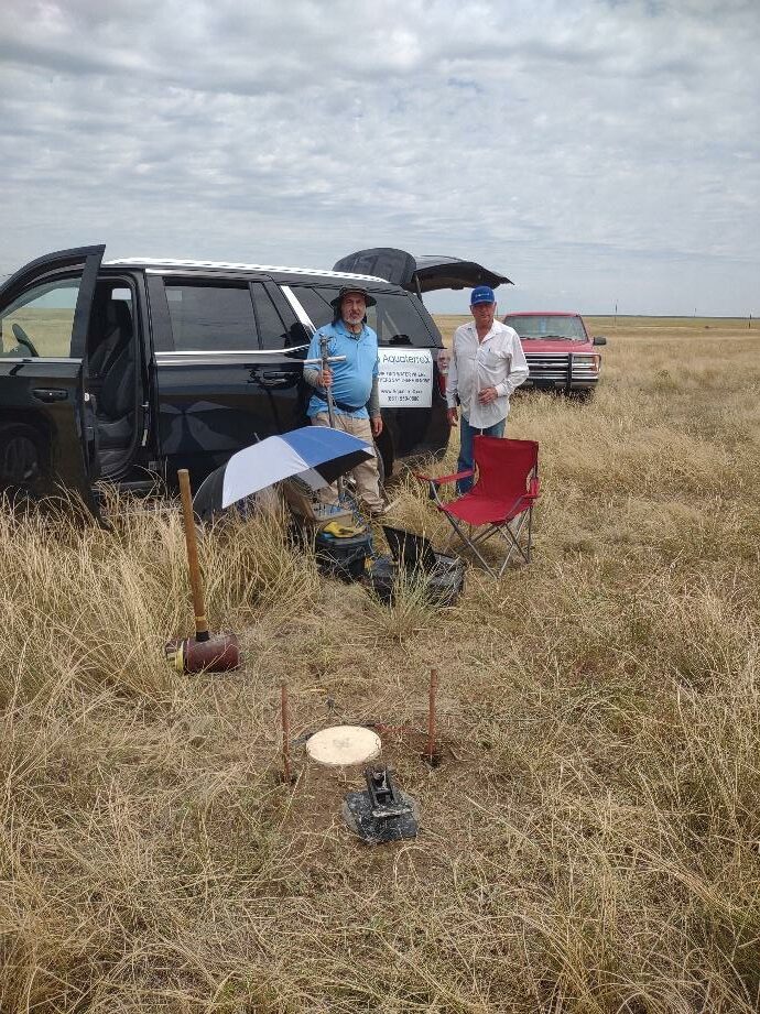AquaterreX field vehicle and survey team conducting groundwater studies on the Oklahoma prairie.